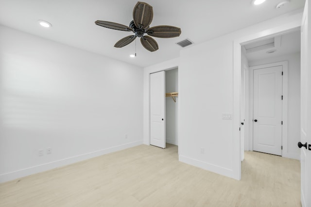 unfurnished bedroom with ceiling fan, a closet, and light hardwood / wood-style flooring