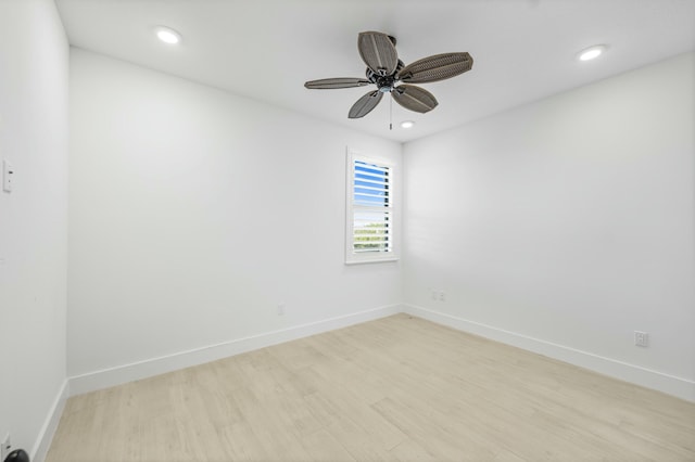 spare room with ceiling fan and light hardwood / wood-style floors