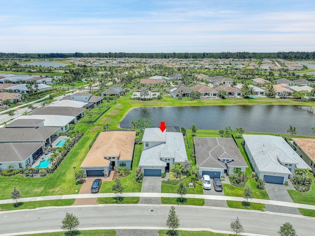 birds eye view of property with a water view