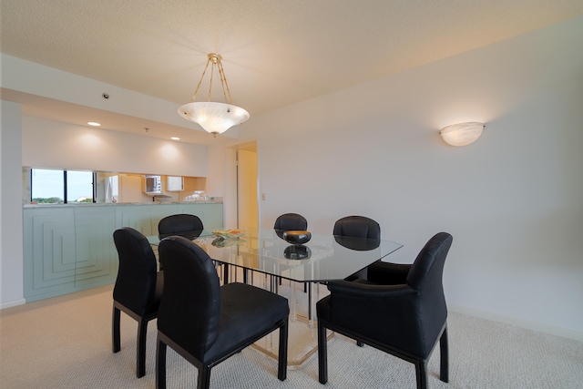 dining area with light carpet