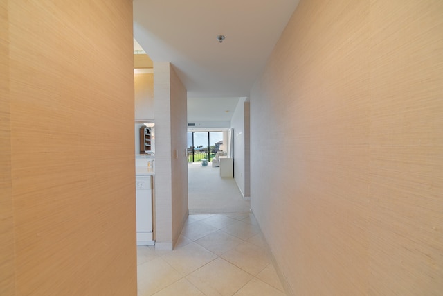 hallway featuring light tile patterned floors