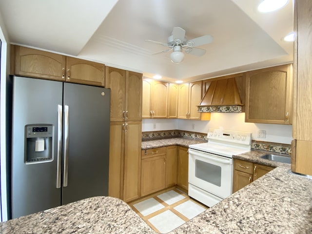 kitchen with premium range hood, electric stove, sink, ceiling fan, and stainless steel fridge with ice dispenser