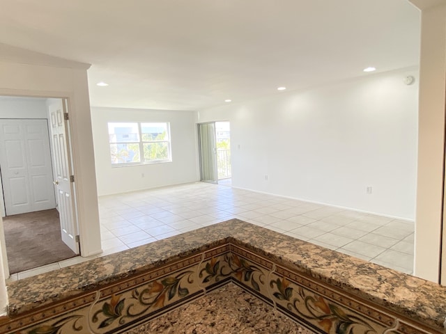 empty room featuring light tile patterned floors