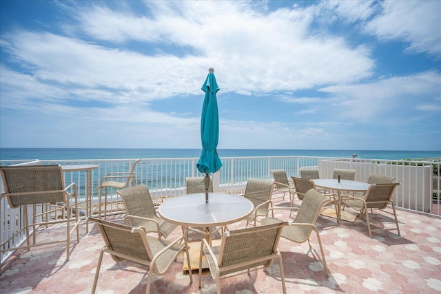 view of patio with a view of the beach and a water view