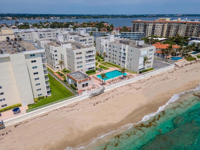 bird's eye view featuring a view of the beach and a water view