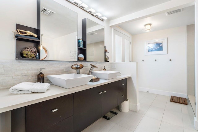 bathroom featuring tile patterned flooring, vanity, and tile walls