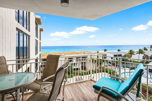 balcony featuring a water view