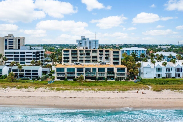 aerial view featuring a water view and a view of the beach