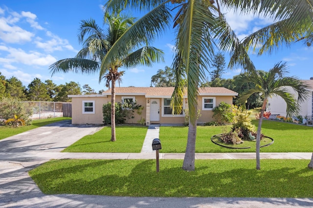 single story home with a front lawn