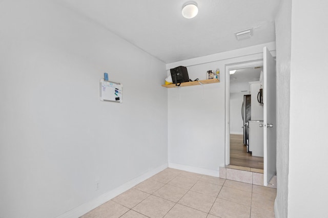 interior space featuring light tile patterned flooring