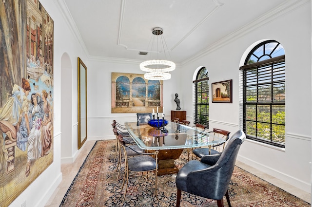 dining area with crown molding and an inviting chandelier