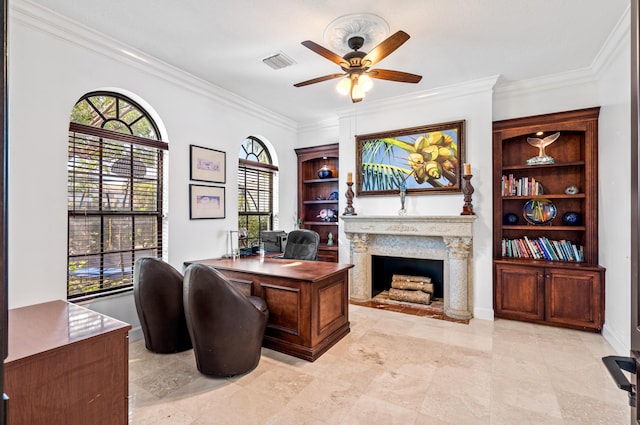 office area featuring built in shelves, crown molding, and ceiling fan