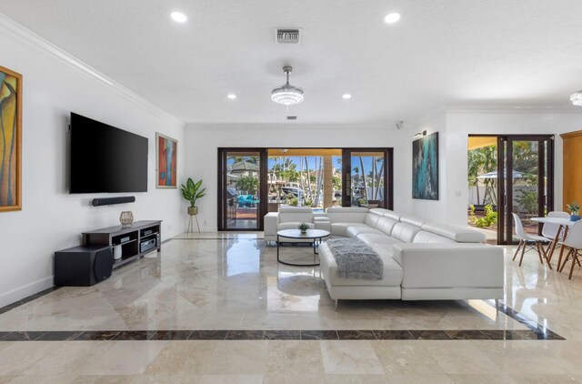 living room with crown molding, french doors, and a healthy amount of sunlight