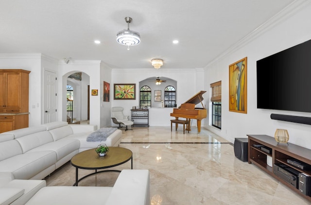 living room featuring crown molding and ceiling fan