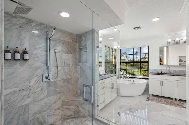 bathroom featuring vanity, plus walk in shower, and a textured ceiling