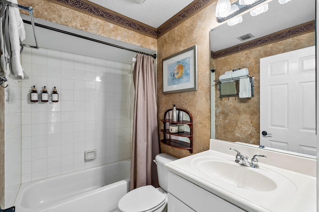 full bathroom featuring a textured ceiling, toilet, vanity, and shower / bath combo with shower curtain