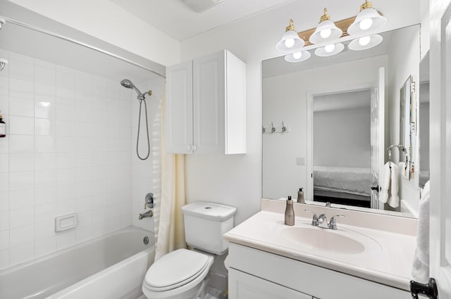 full bathroom featuring shower / bath combo, vanity, and toilet