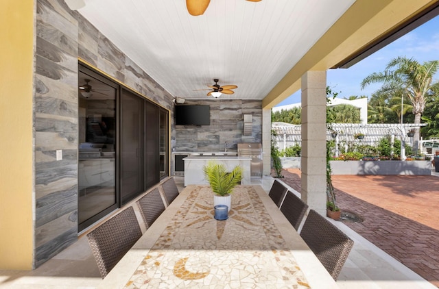 view of patio featuring ceiling fan