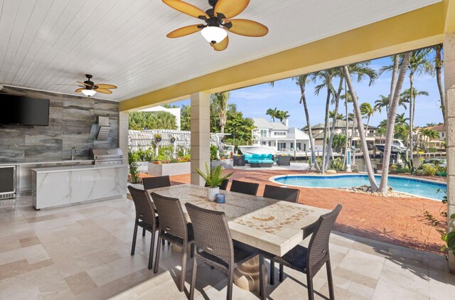 dining space featuring ceiling fan and wood ceiling