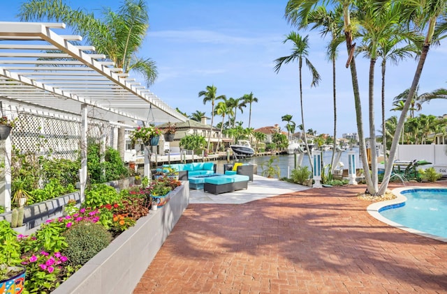 view of swimming pool with a pergola, outdoor lounge area, a water view, a patio area, and pool water feature