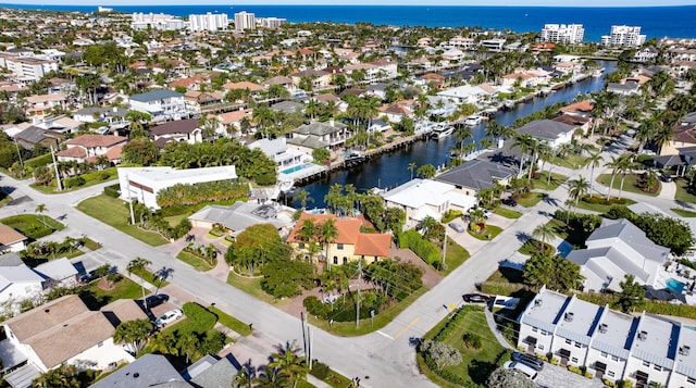 birds eye view of property featuring a water view