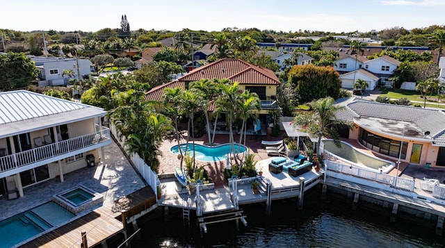 birds eye view of property with a water view