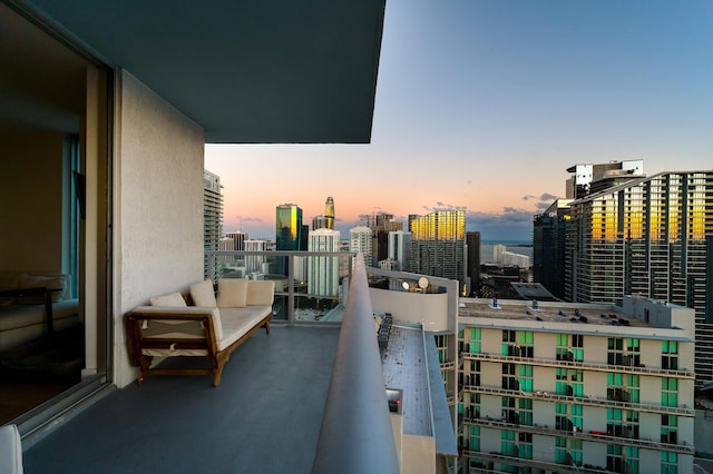 view of balcony at dusk