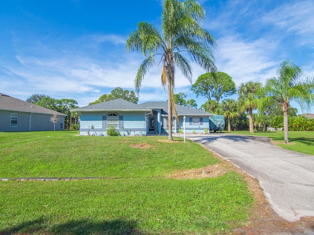 single story home with a front yard