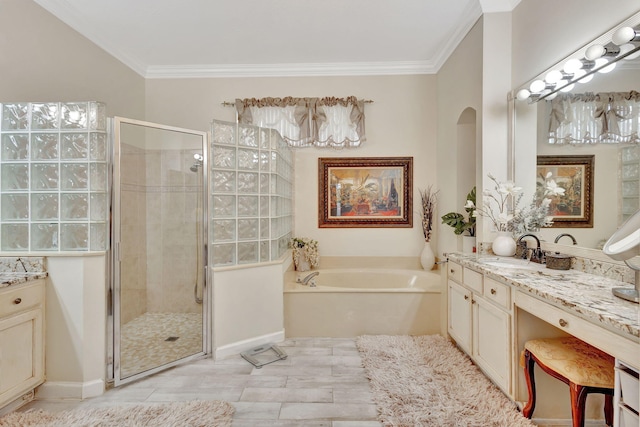 bathroom with crown molding, vanity, and plus walk in shower