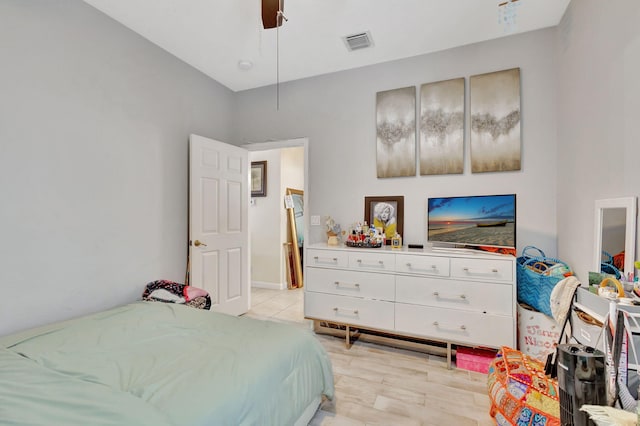 bedroom featuring ceiling fan and light hardwood / wood-style flooring