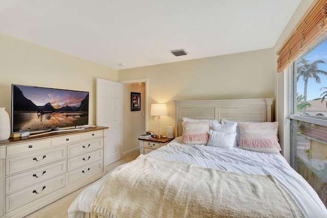 bedroom with light colored carpet