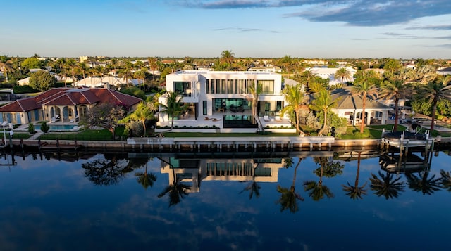 birds eye view of property with a residential view and a water view