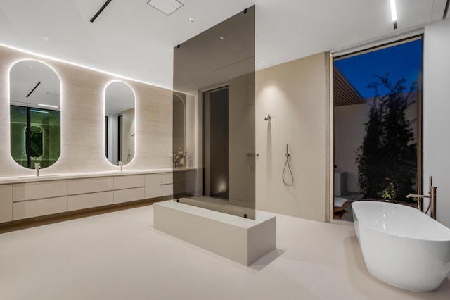 35 Spoonbill Rd, Manalapan, FL 33462 - bathroom with a soaking tub, walk in shower, and double vanity