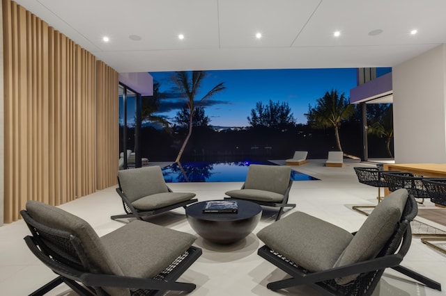 view of patio with an outdoor pool and an outdoor living space