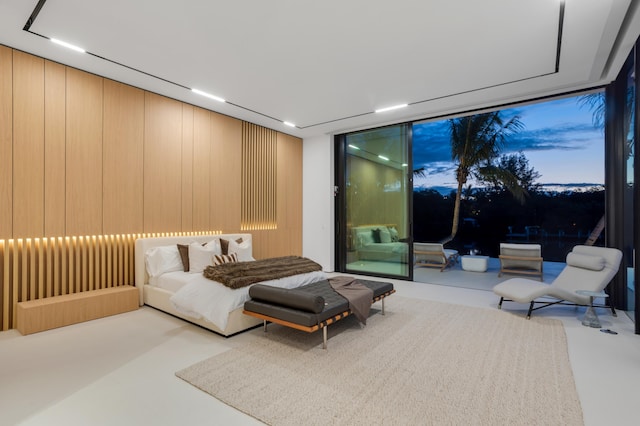 bedroom featuring a wall of windows