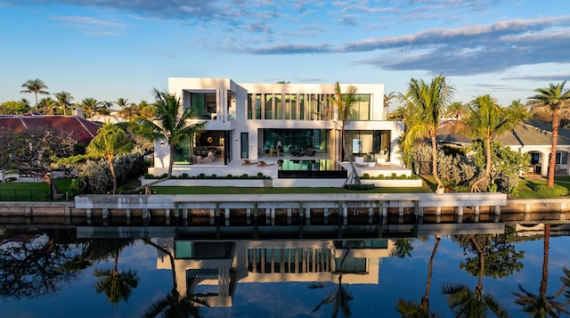 35 Spoonbill Rd, Manalapan, FL 33462 - back of property with a balcony, a patio area, a water view, and stucco siding