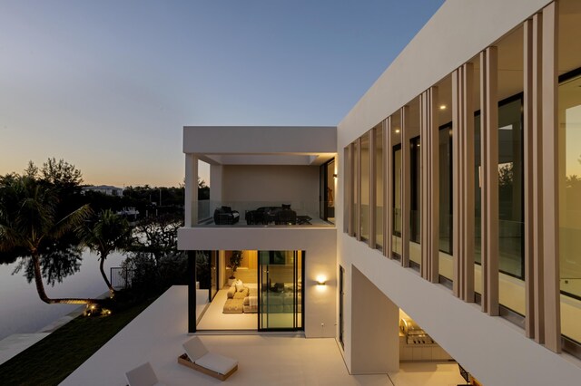 patio terrace at dusk with a balcony