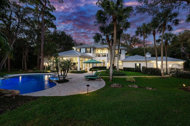 view of front of home with a balcony