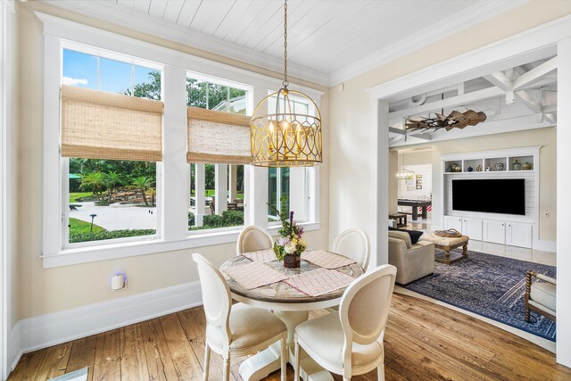 kitchen featuring white cabinetry, dark hardwood / wood-style floors, range with two ovens, wood ceiling, and ornamental molding