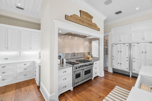 living room featuring french doors, coffered ceiling, beamed ceiling, light wood-type flooring, and ornamental molding