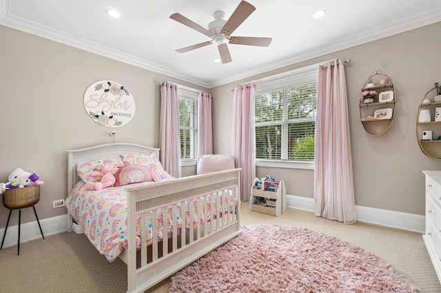 bedroom with ornamental molding, light colored carpet, and ceiling fan