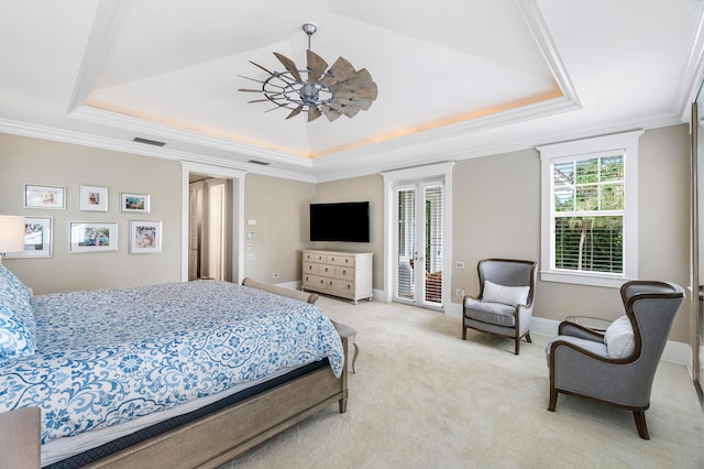 bedroom with a raised ceiling, ornamental molding, access to outside, and light colored carpet