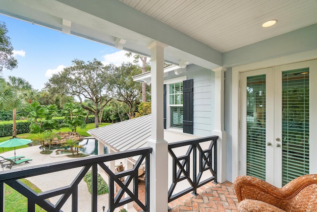 balcony featuring french doors and a patio area