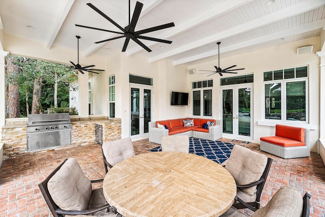 view of patio / terrace featuring french doors, grilling area, and exterior kitchen