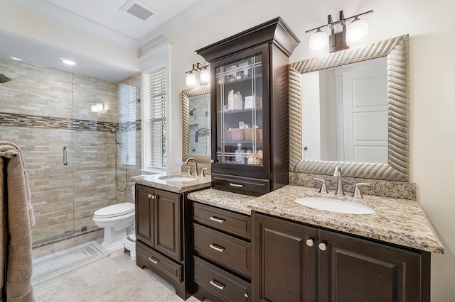 bathroom with crown molding, vanity, toilet, and a shower with door