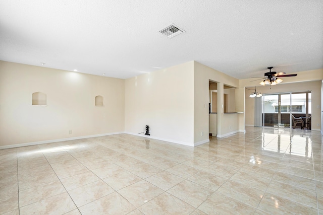 spare room with ceiling fan and a textured ceiling