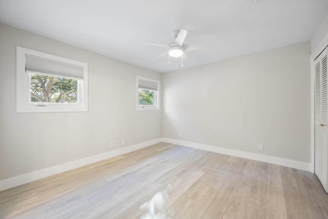 spare room with ceiling fan and light hardwood / wood-style flooring