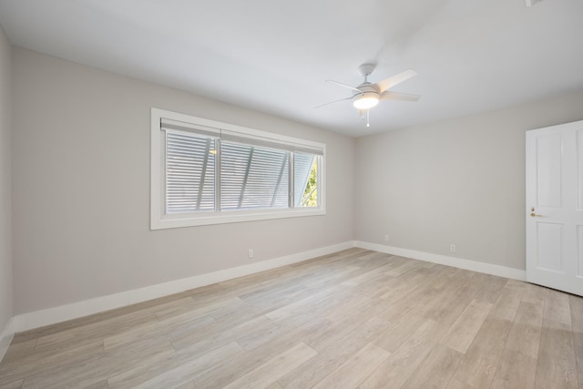 unfurnished room with ceiling fan and light hardwood / wood-style flooring