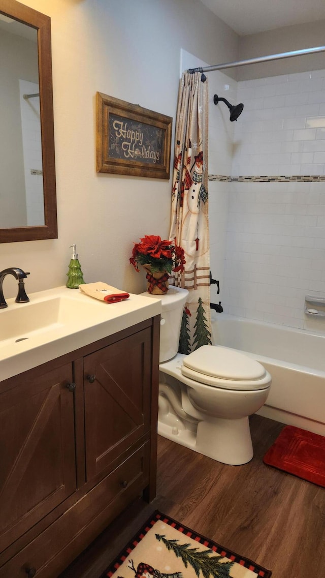 full bathroom with vanity, wood-type flooring, toilet, and shower / bathtub combination with curtain