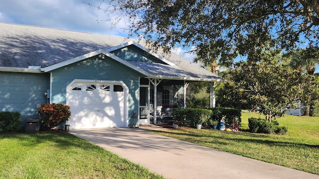 view of front facade with a garage and a front lawn